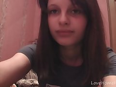 Beautiful brunette takes off her clothes on camera